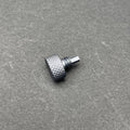 A close-up of the UV Scope Rod Wrench Tool, a small, dark gray metal tool with a textured, knurled cylindrical head and a threaded shaft with a hexagonal end.