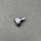 A close-up of the UV Scope Rod Wrench Tool, a small, dark gray metal tool with a textured, knurled cylindrical head and a threaded shaft with a hexagonal end.